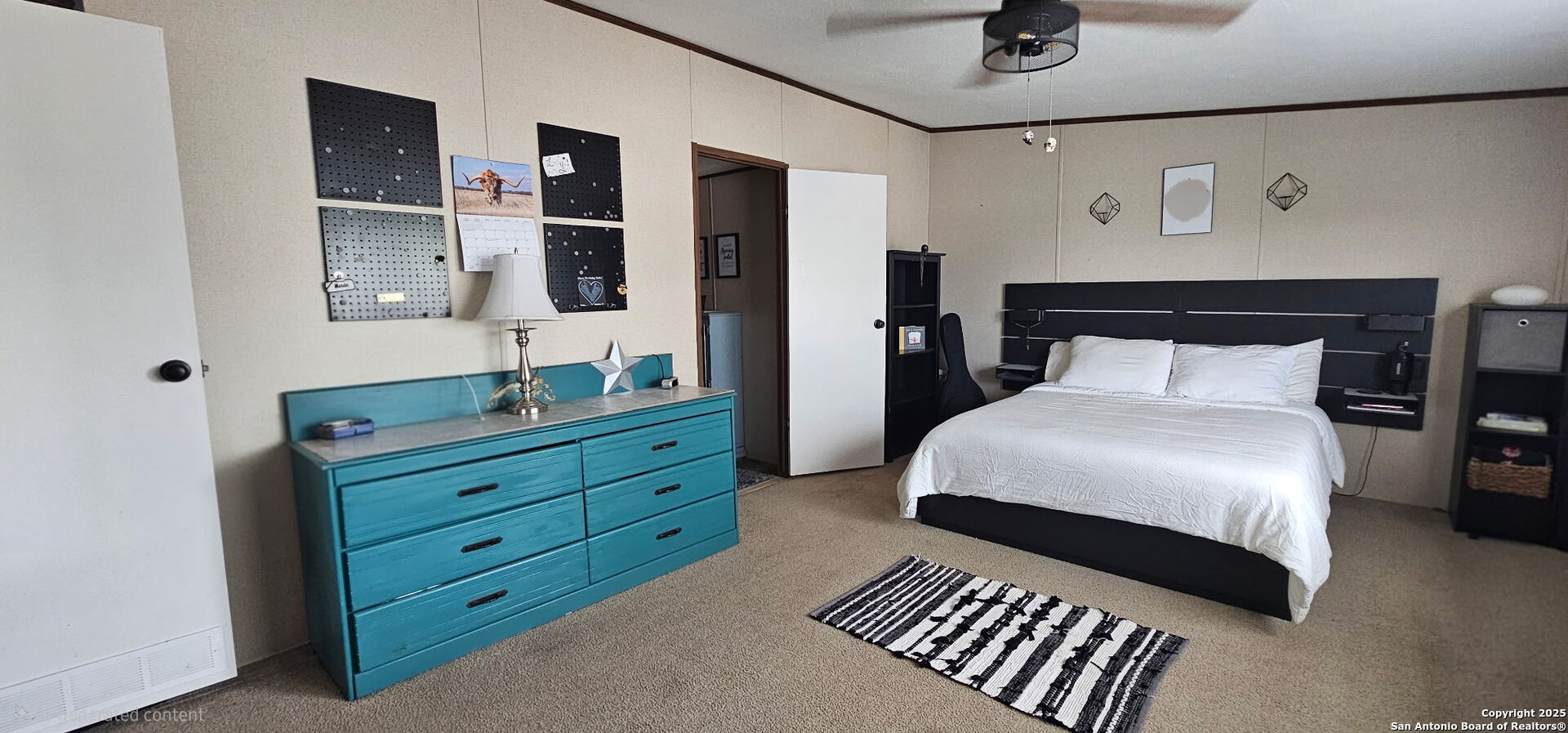 275 W Trail Pleasanton, TX 78064 - Photo 7 of 17 a bedroom with a bed and a closet