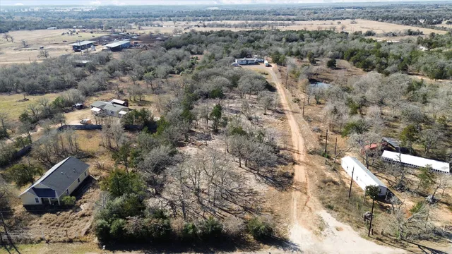 an aerial view of house with yard