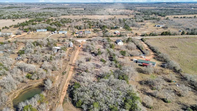 an aerial view of house with yard