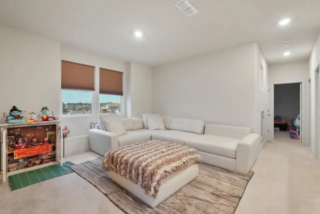 a living room with furniture a window and a fireplace