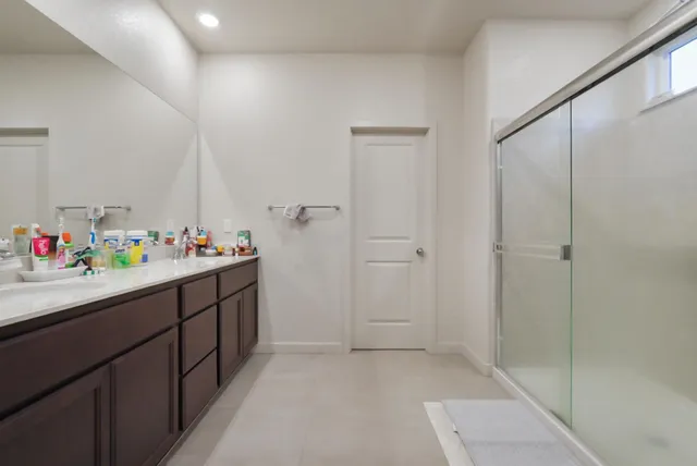 a bathroom with a sink and a shower