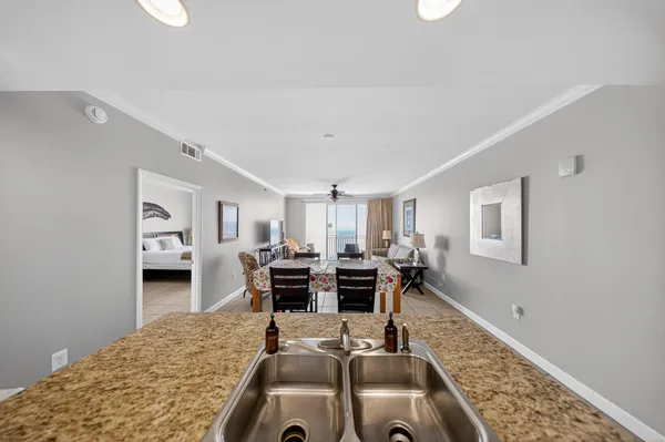 a room with furniture or chandelier and a wooden floor