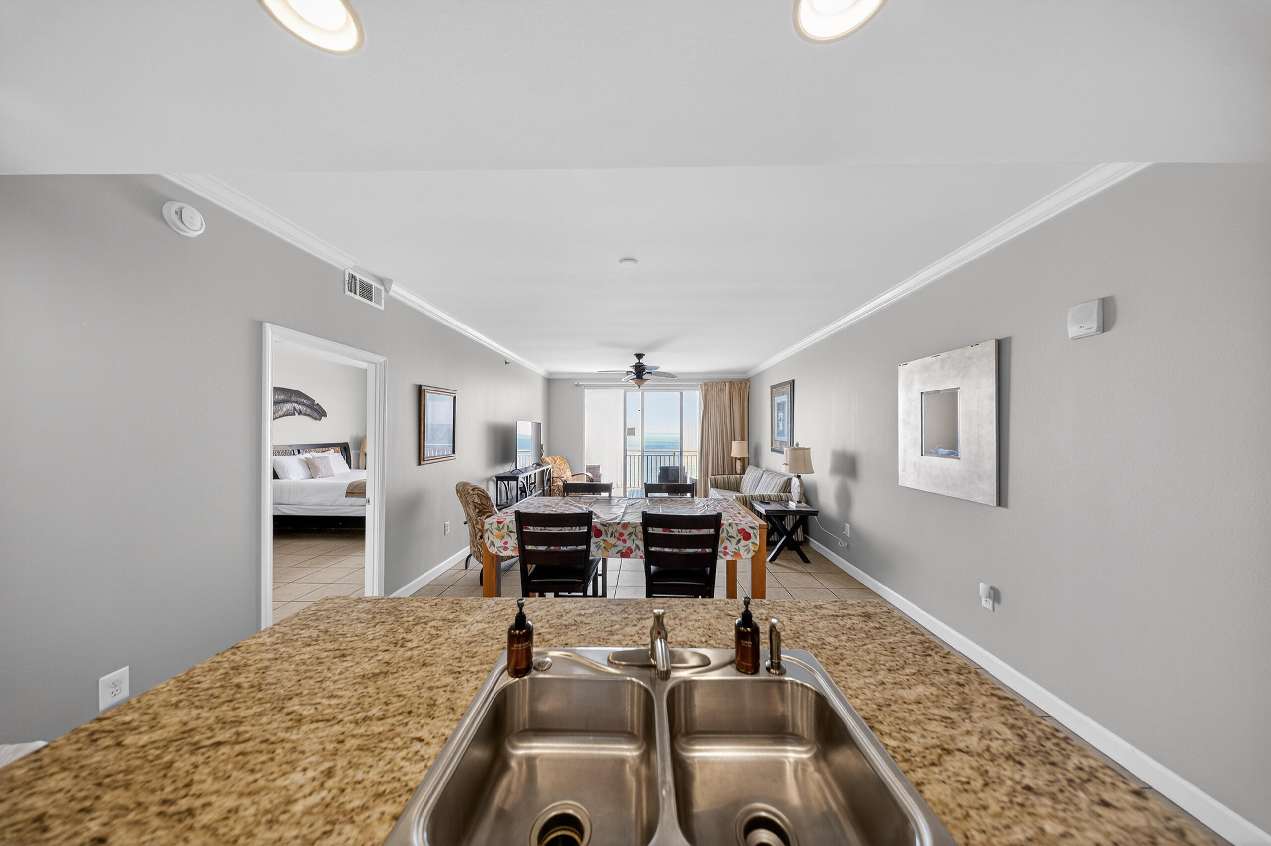 17739 Front Beach Road, Unit 1703W Panama City Beach, FL 32413 - Photo 17 of 50 a room with furniture or chandelier and a wooden floor