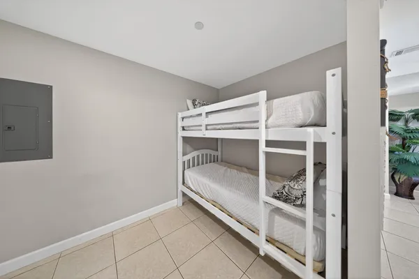 a room with a bed and a mirror