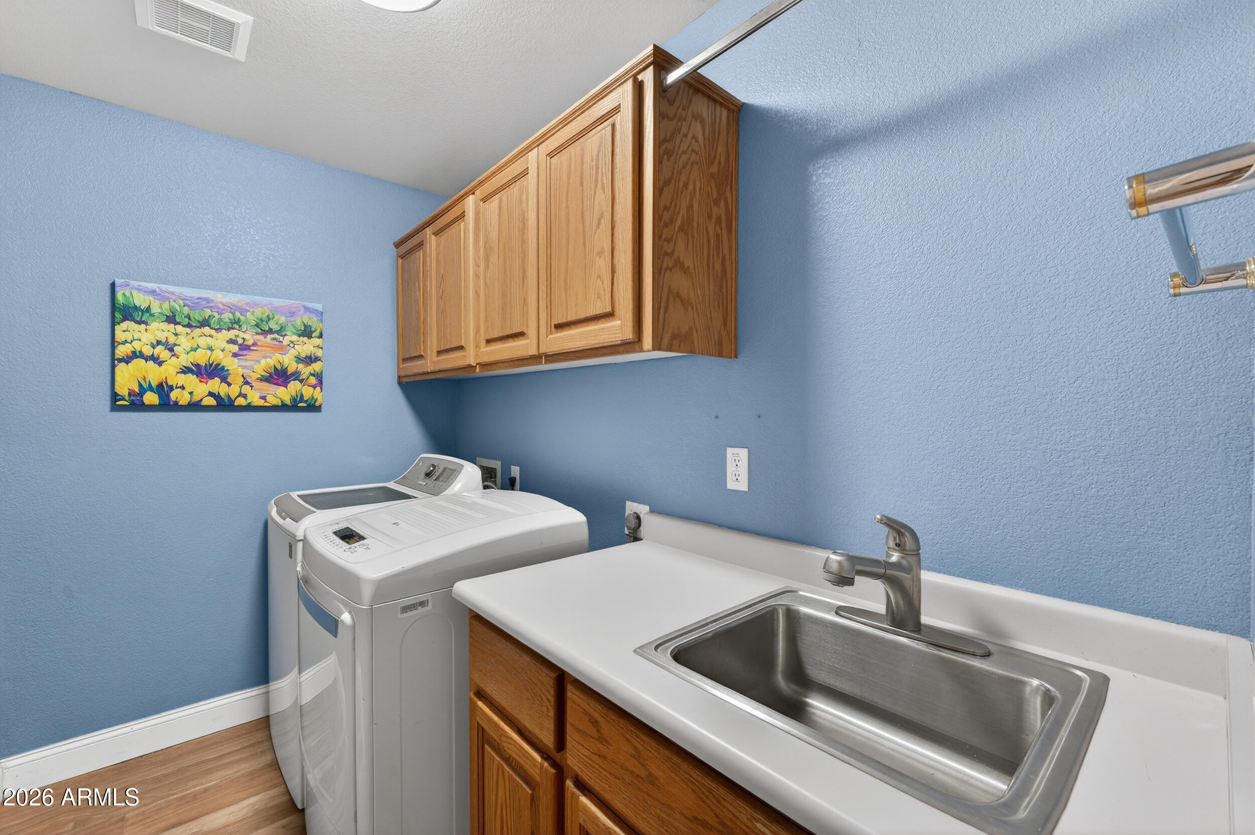 1539 East Winged Foot Road Phoenix, AZ 85022 - Photo 46 of 64 a utility room with dryer and washer