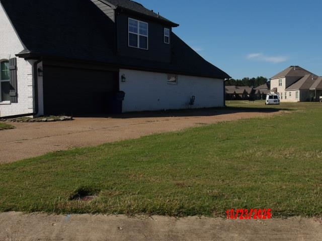 25 Daisy Way Somerville, TN 38068 - Photo 3 of 23 a front view of a house with a yard