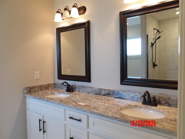 25 Daisy Way Somerville, TN 38068 - Photo 5 of 23 a bathroom with a granite countertop sink and a mirror