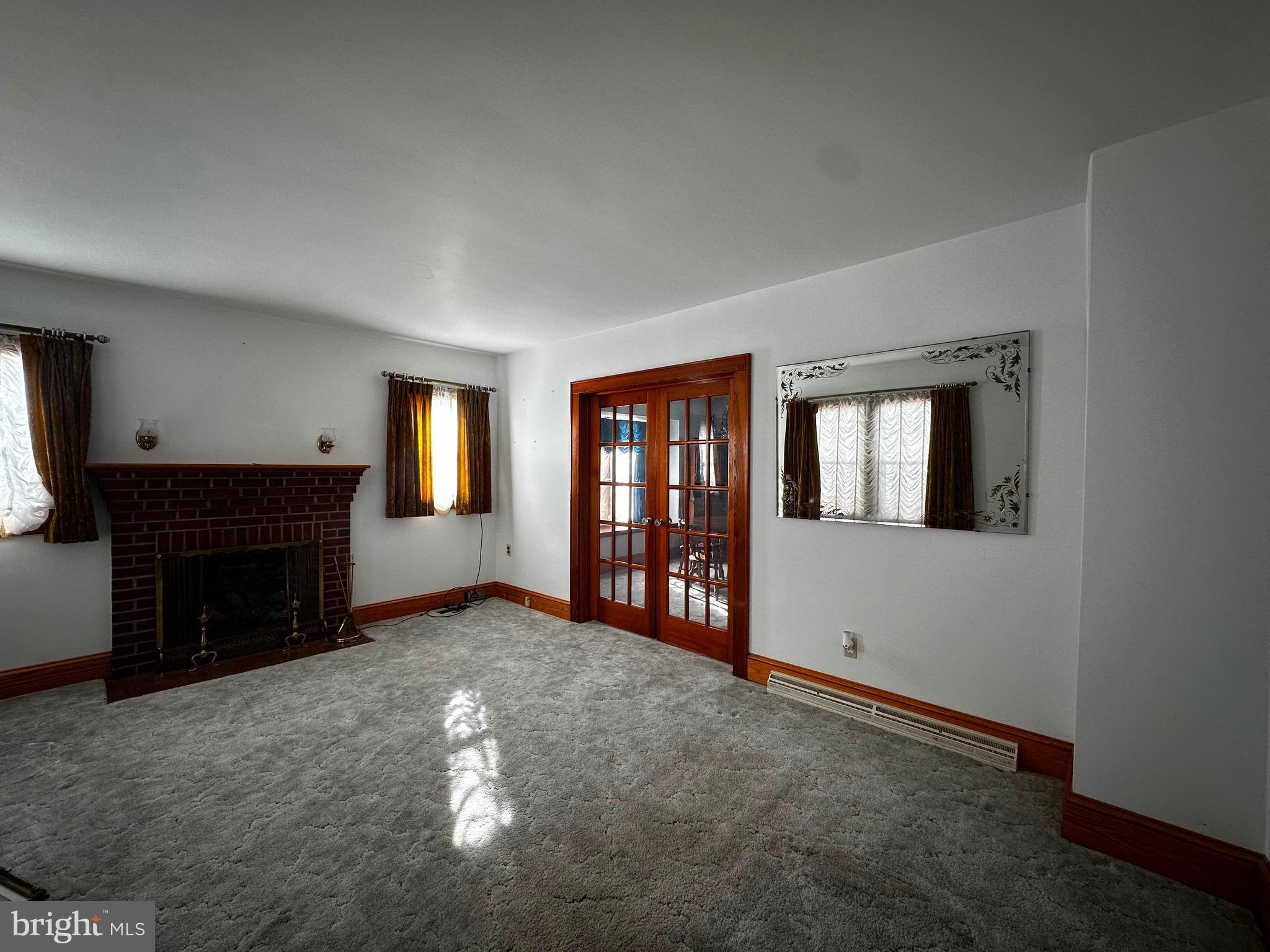 3500 Paw Paw Road Paw Paw, WV 25434 - Photo 21 of 48 a view of an empty room with window and fireplace