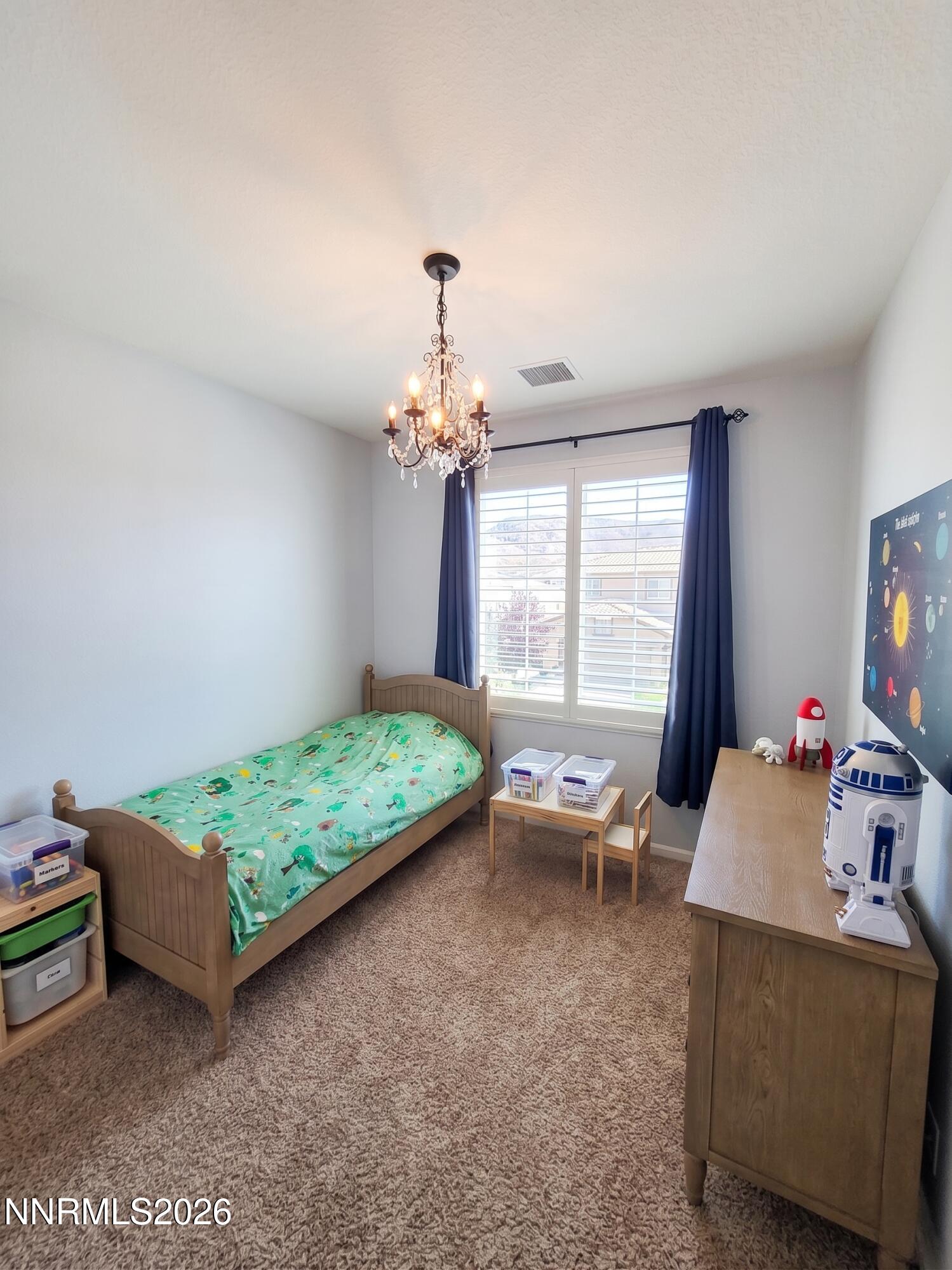 2775 Bonfire Lane Reno, NV 89521 - Photo 32 of 41 a bedroom with bed and a window