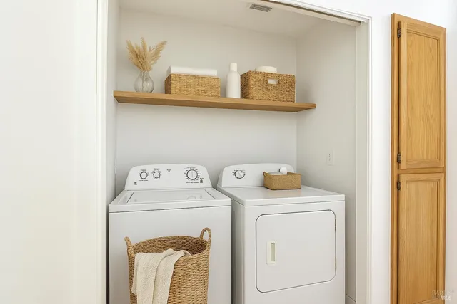 a utility room with dryer and washer