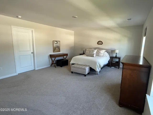 a bedroom with bed and window