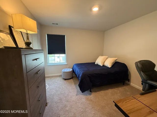 a bedroom with a bed and furniture