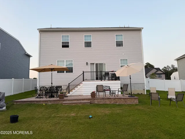 a view of a swimming pool with chairs