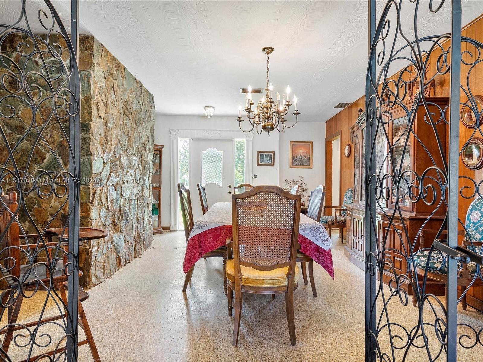 5901 Southwest 160th Avenue Southwest Ranches, FL 33331 - Photo 12 of 92 a view of a dining room with furniture and chandelier