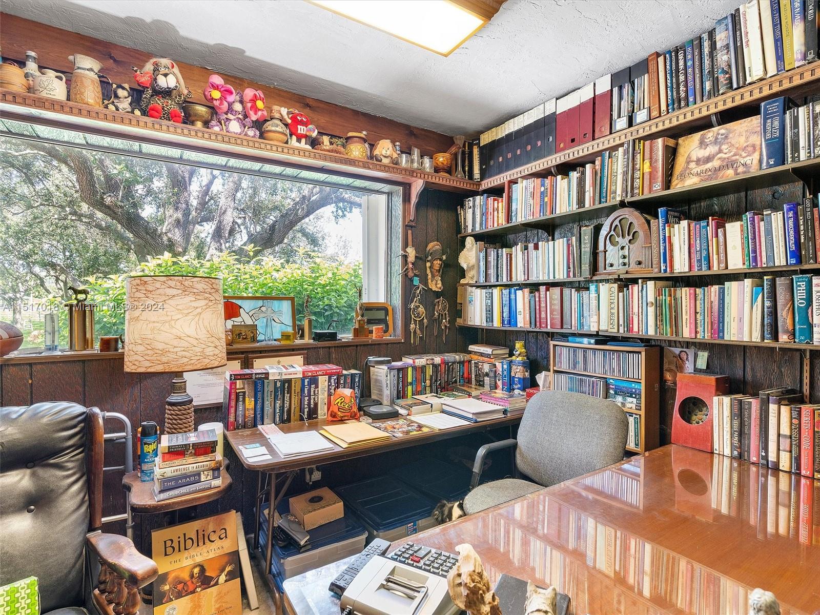 5901 Southwest 160th Avenue Southwest Ranches, FL 33331 - Photo 30 of 92 a work room with furniture window and book shelf