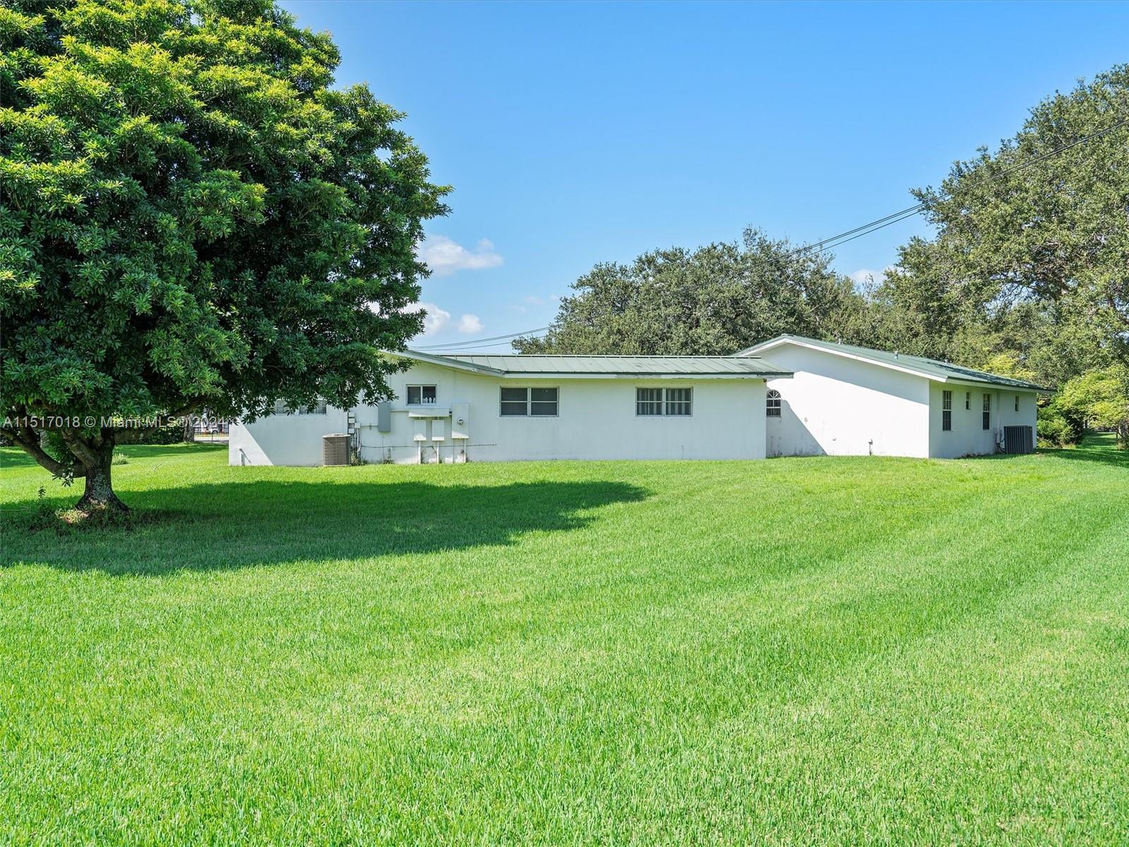 5901 Southwest 160th Avenue Southwest Ranches, FL 33331 - Photo 3 of 92 a front view of house with yard and green space