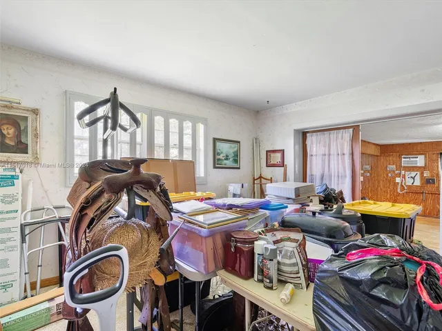 a bathroom with a sink a toilet and shower curtain