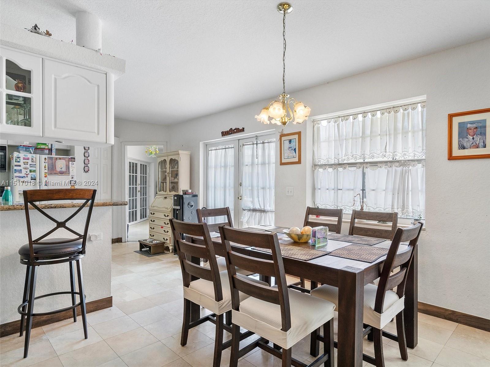 5901 Southwest 160th Avenue Southwest Ranches, FL 33331 - Photo 48 of 92 a view of a dining room with furniture window and outside view