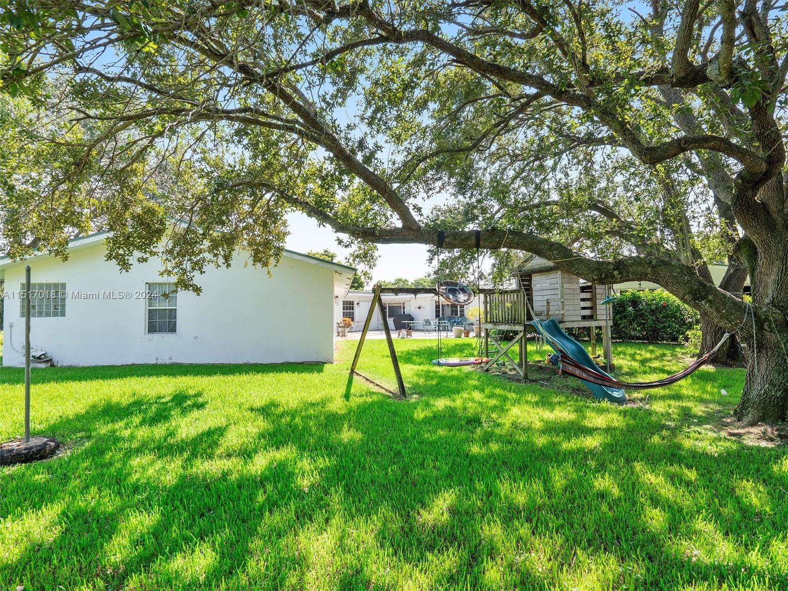 5901 Southwest 160th Avenue Southwest Ranches, FL 33331 - Photo 6 of 92 a view of a backyard with a trampoline