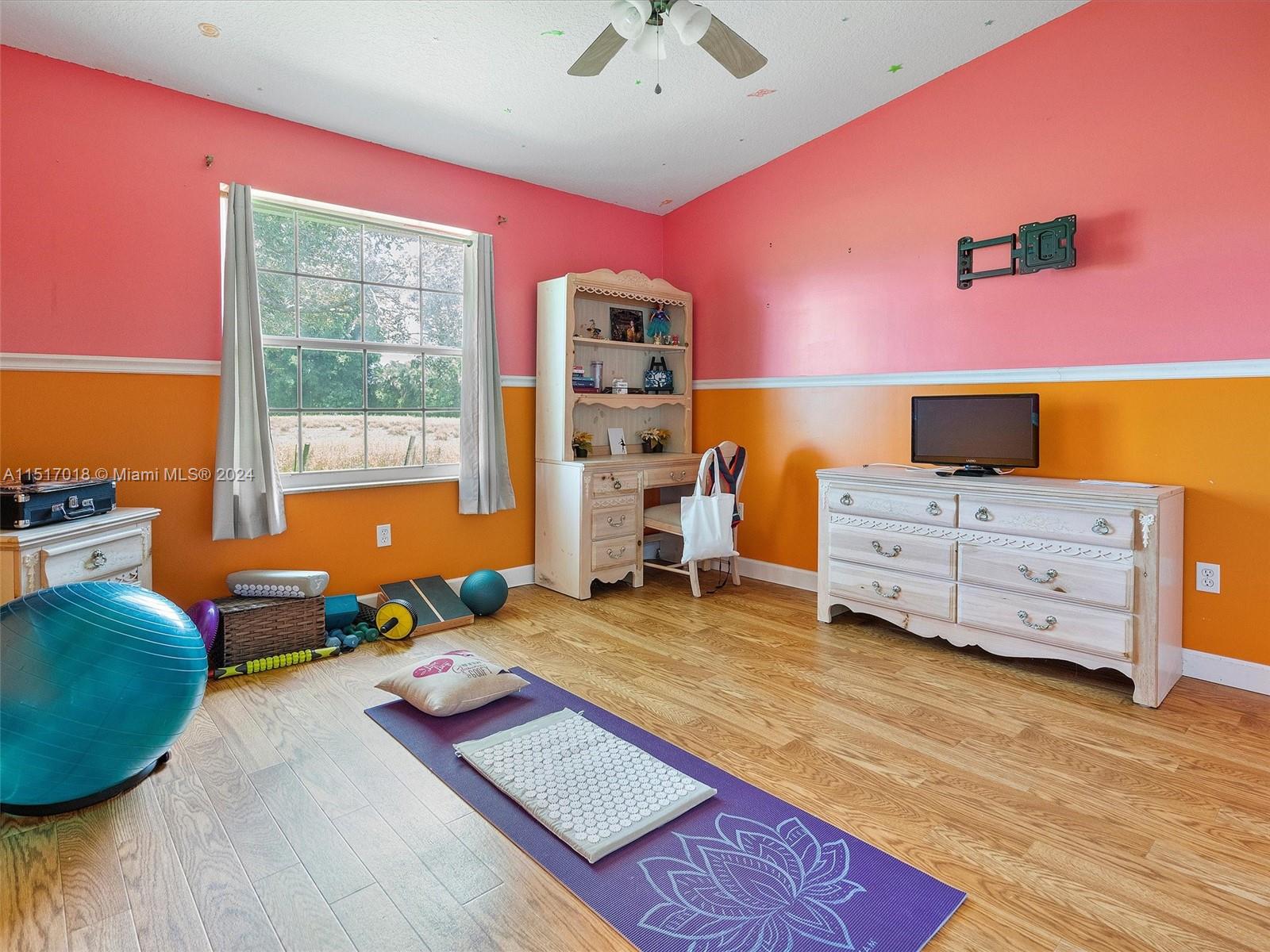 5901 Southwest 160th Avenue Southwest Ranches, FL 33331 - Photo 64 of 92 a bedroom with furniture and a wooden floor