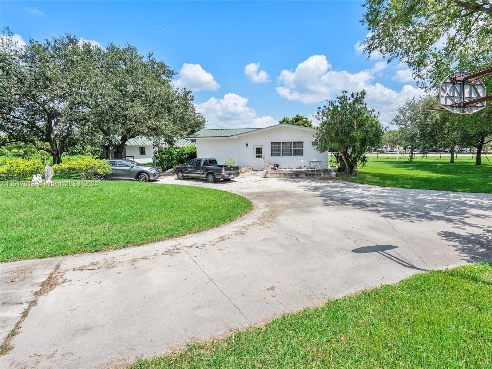 5901 Southwest 160th Avenue Southwest Ranches, FL 33331 - Photo 7 of 92 a view of a house with a yard
