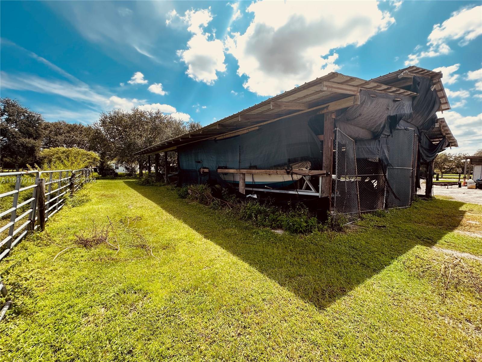5901 Southwest 160th Avenue Southwest Ranches, FL 33331 - Photo 80 of 92 a view of a swimming pool with a garden and seating area
