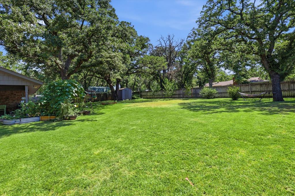 3205 South Garland Street Decatur, TX 76234 - Photo 24 of 30 Expansive green lawn framed by mature trees