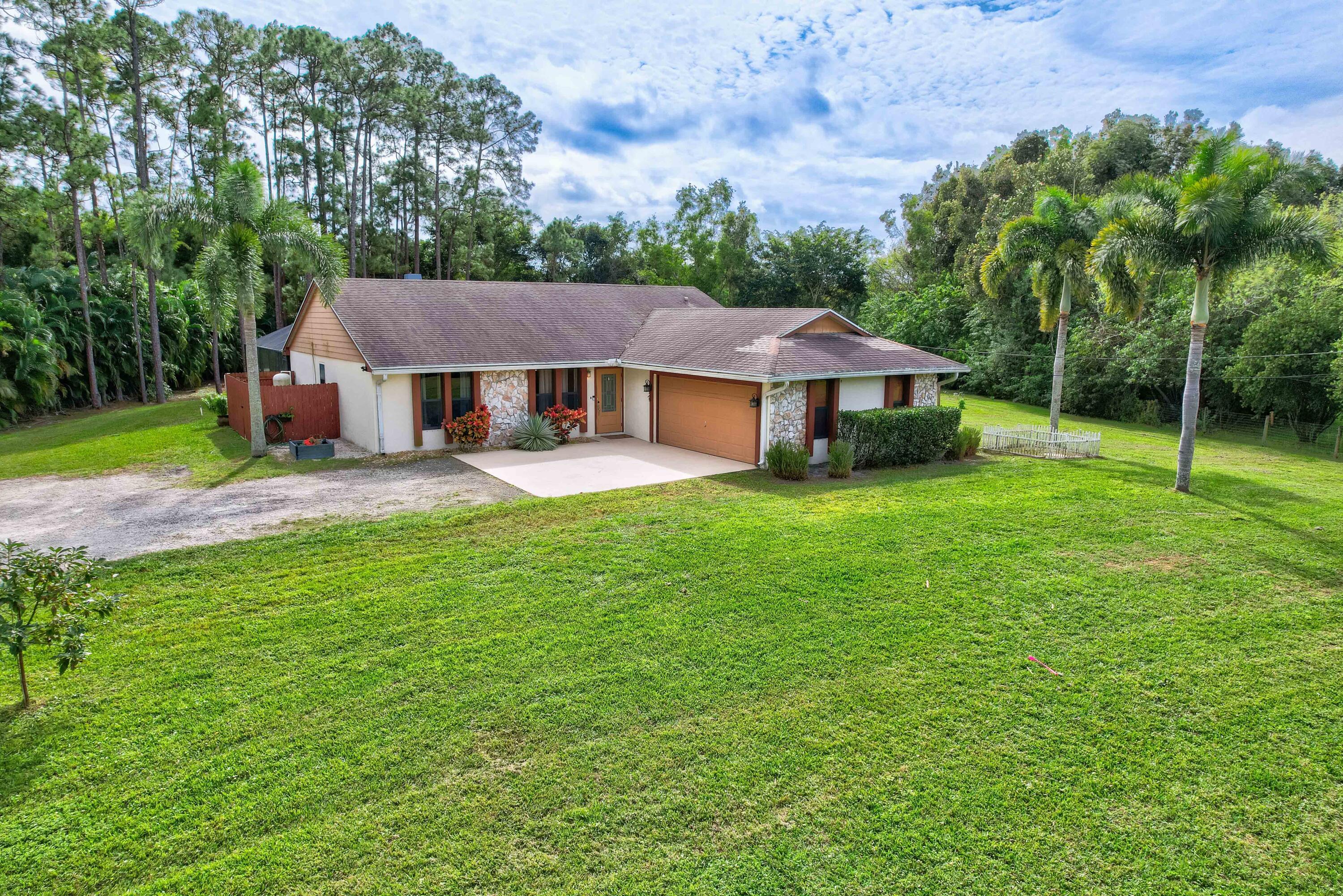 12448 154th Road North Jupiter, FL 33478 - Photo 47 of 66 Front Exterior