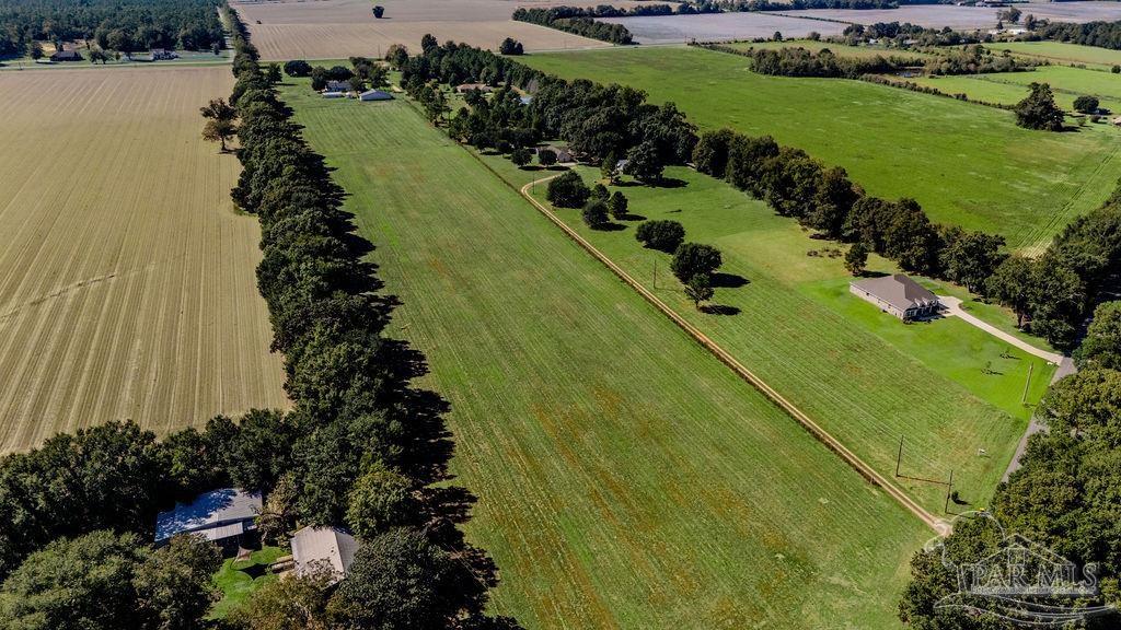 2 A Tidwell Road Pace, FL 32571 - Photo 6 of 7 a view of a garden with a lake