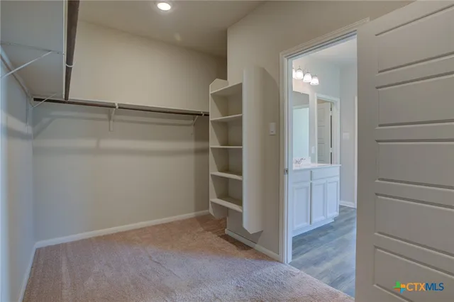 a view of an empty walk in closet