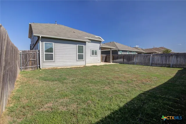 a house view with a garden space