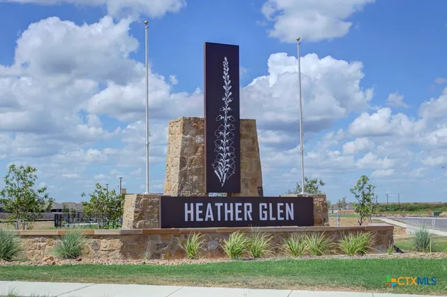 a view of a sign board and yard