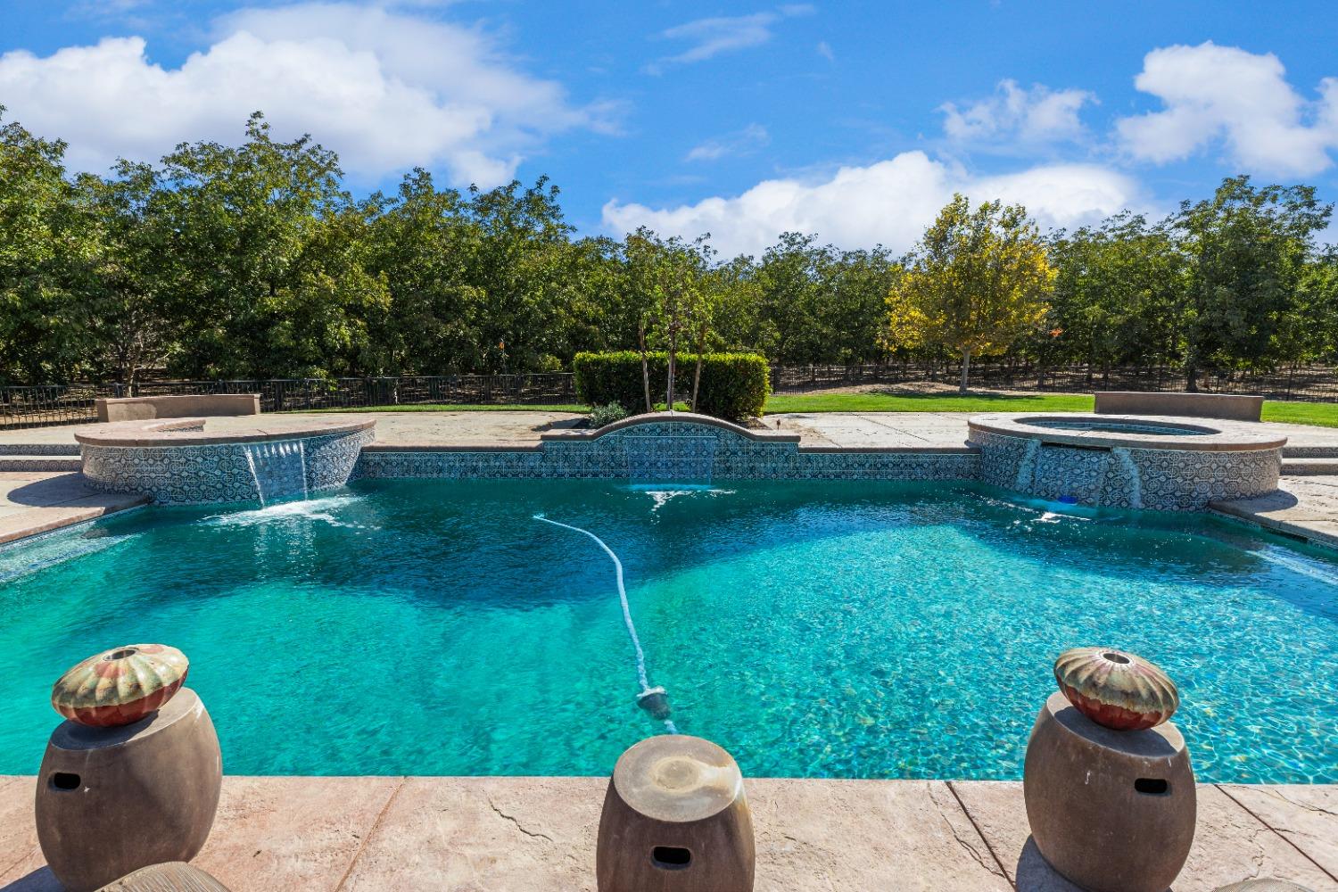 618 Elfers Road Patterson, CA 95363 - Photo 11 of 79 a view of a swimming pool and a back yard