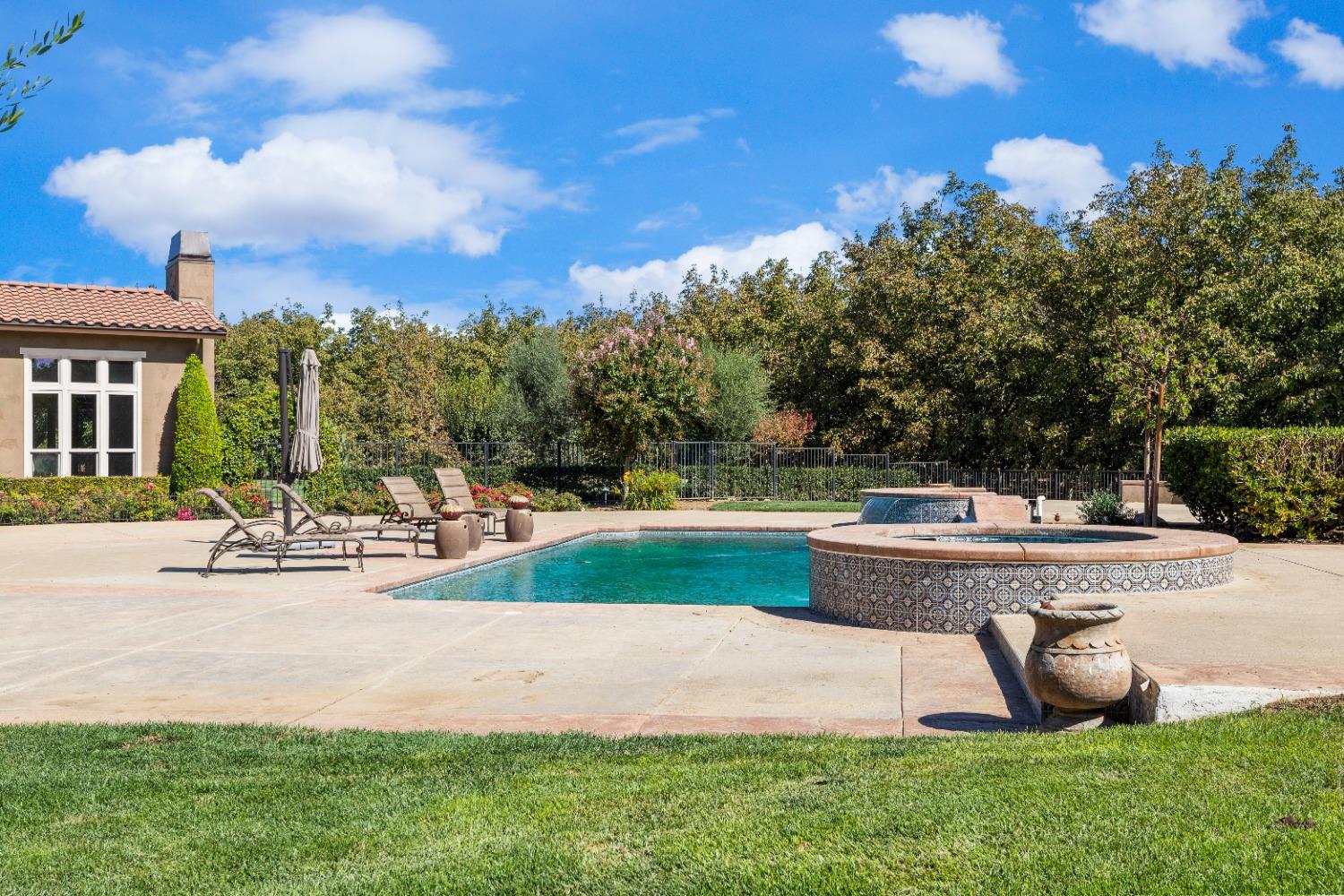 618 Elfers Road Patterson, CA 95363 - Photo 14 of 79 a view of backyard with swimming pool and outdoor seating
