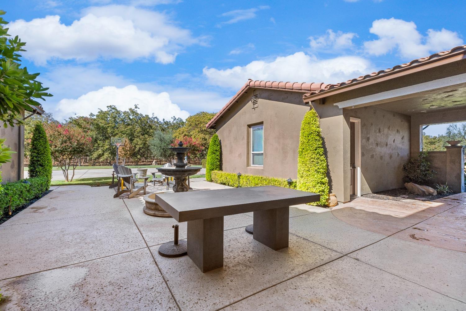 618 Elfers Road Patterson, CA 95363 - Photo 23 of 79 a view of a patio with table and chairs and floor to ceiling window