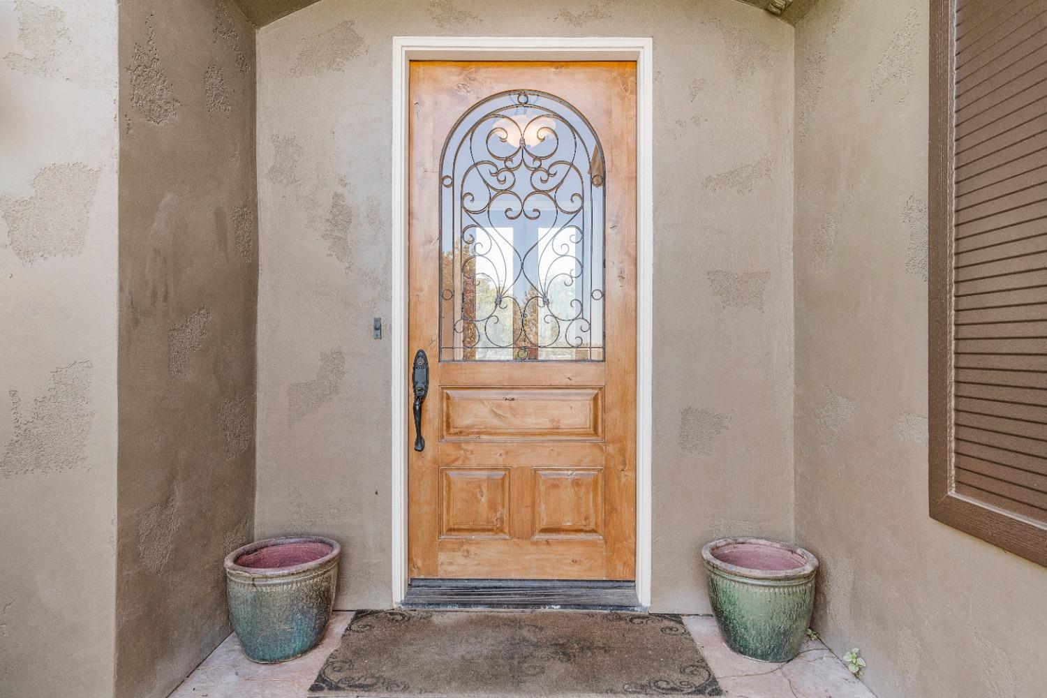 618 Elfers Road Patterson, CA 95363 - Photo 29 of 79 a bathroom with a toilet and a potted plant