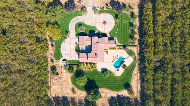 a view of a field with an ocean view