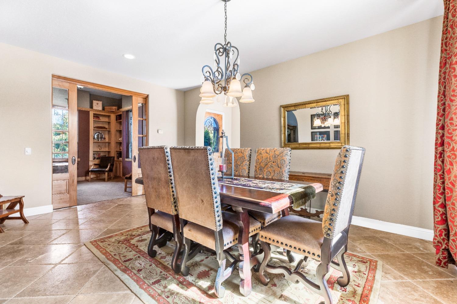 618 Elfers Road Patterson, CA 95363 - Photo 31 of 79 a view of a dining room with furniture and chandelier
