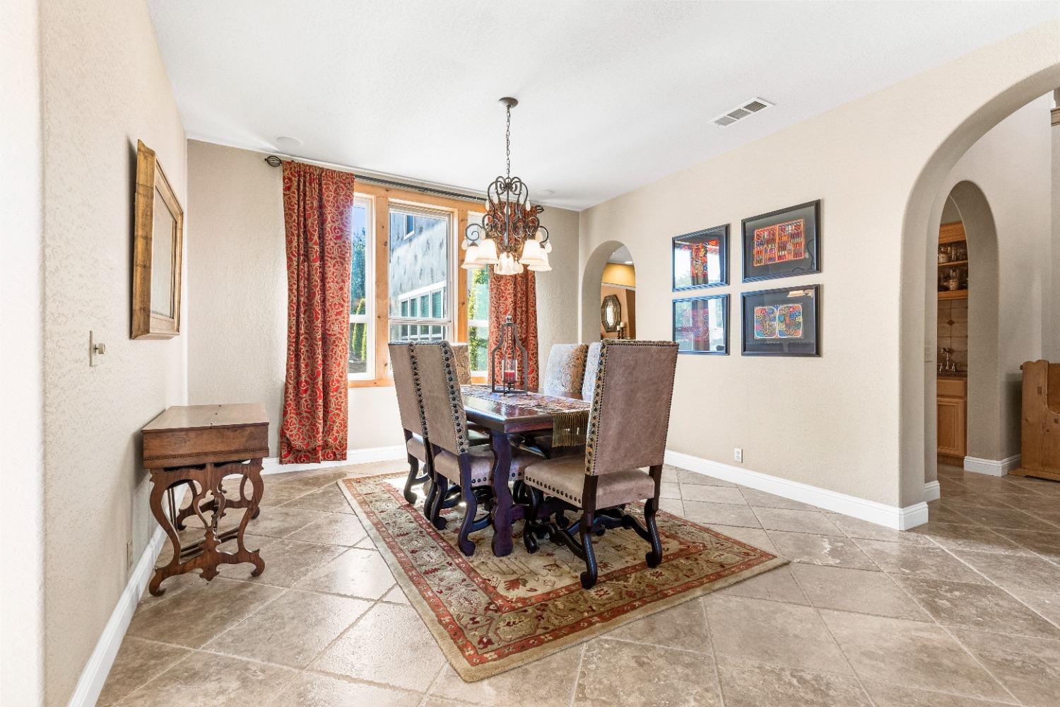 618 Elfers Road Patterson, CA 95363 - Photo 32 of 79 a view of a dining room with furniture window and wooden floor