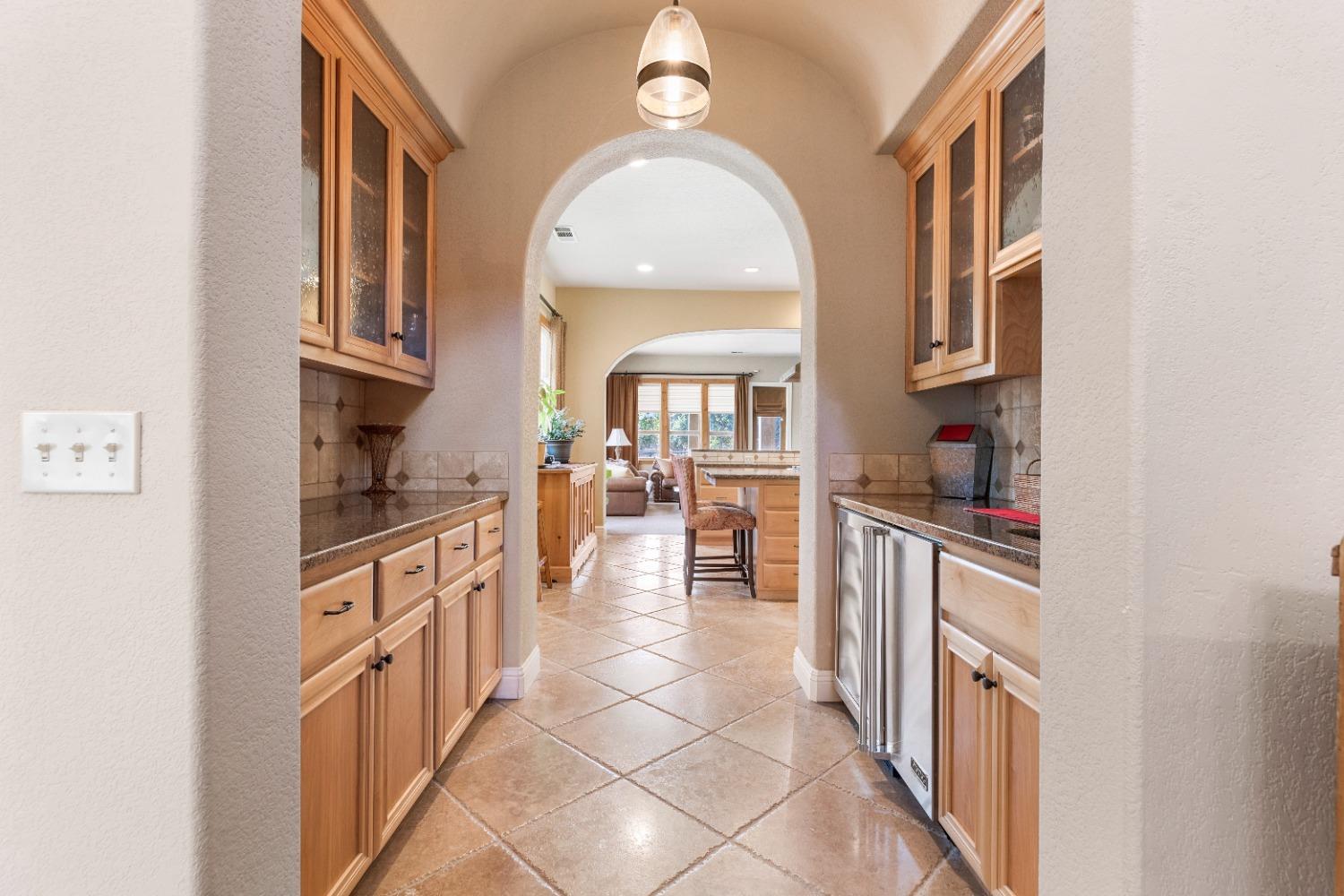 618 Elfers Road Patterson, CA 95363 - Photo 35 of 79 a kitchen with stainless steel appliances granite countertop a stove a sink and a refrigerator
