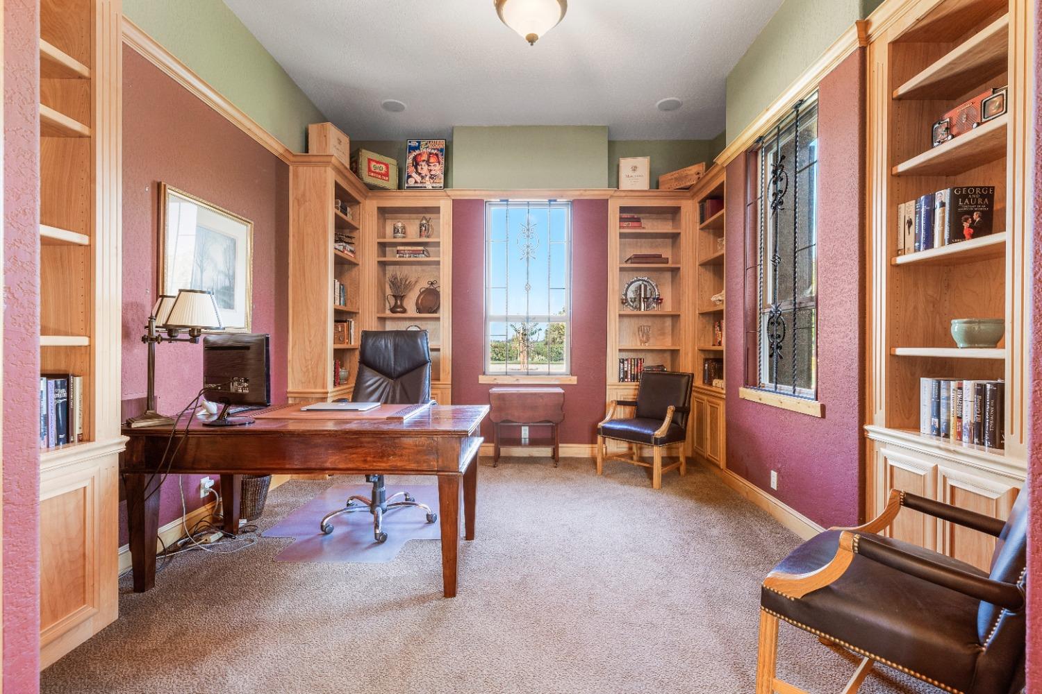 618 Elfers Road Patterson, CA 95363 - Photo 41 of 79 a view of a workspace with furniture and a large window