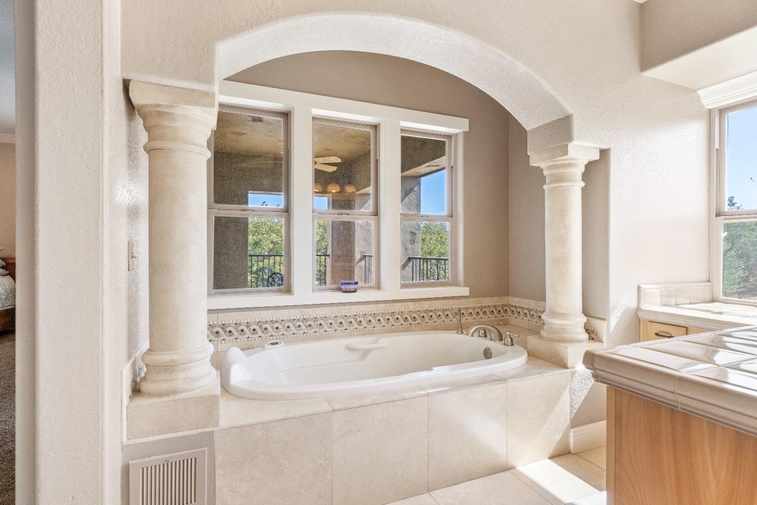 618 Elfers Road Patterson, CA 95363 - Photo 45 of 79 a white bath tub sitting next to a window