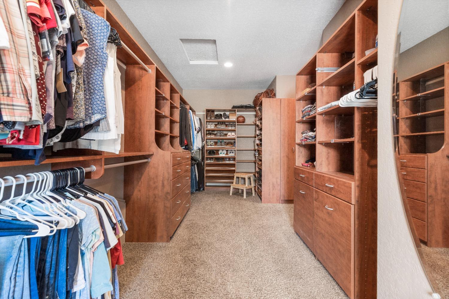 618 Elfers Road Patterson, CA 95363 - Photo 52 of 79 a view of walk in closet with clothes and shoes