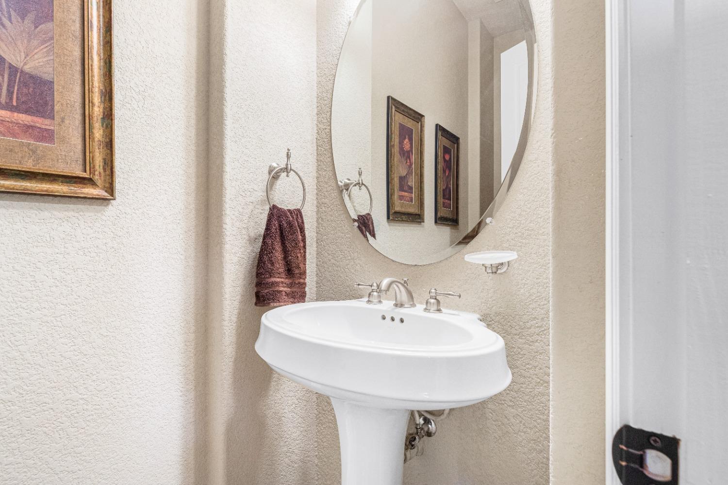 618 Elfers Road Patterson, CA 95363 - Photo 60 of 79 a bathroom with a sink and a mirror