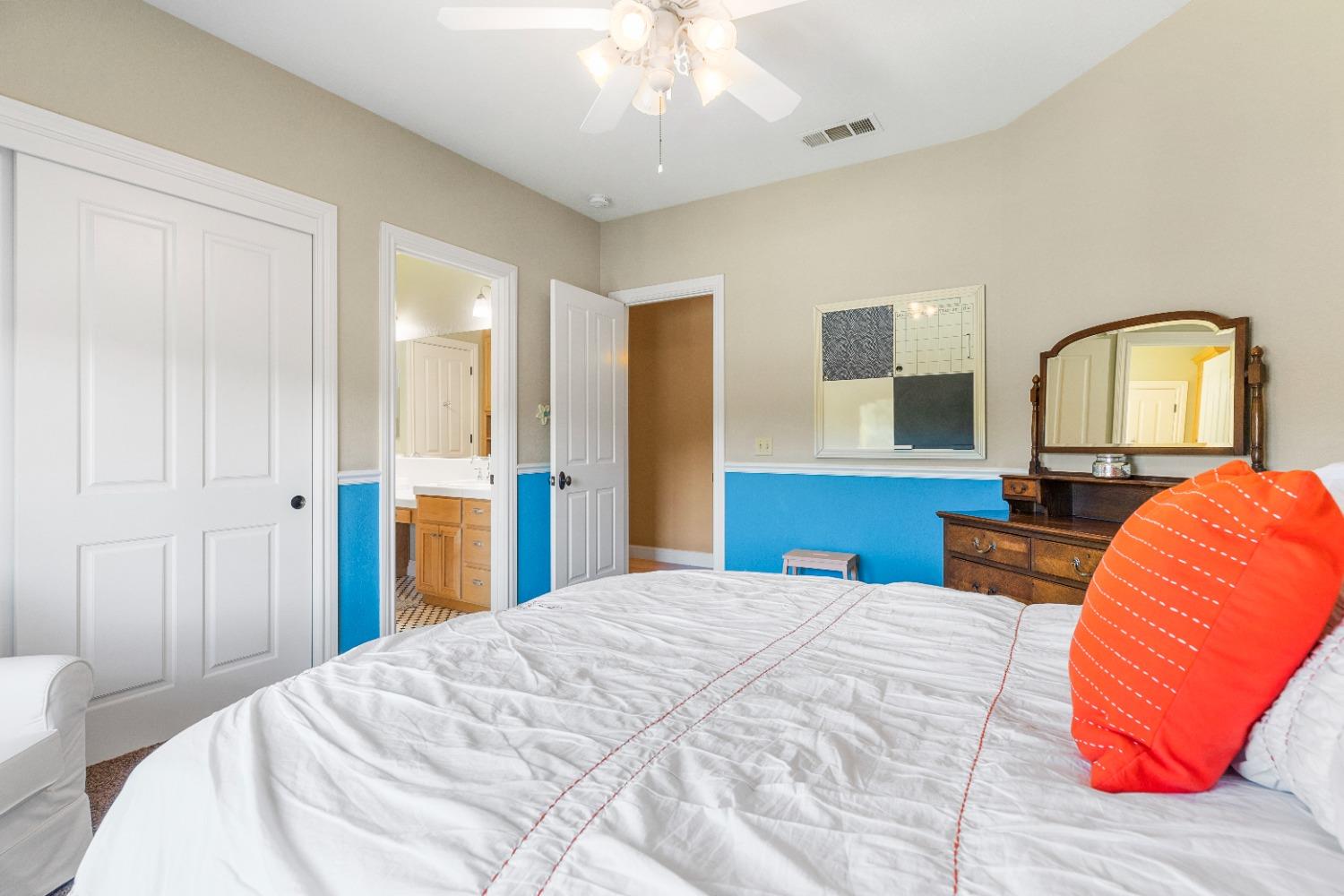 618 Elfers Road Patterson, CA 95363 - Photo 70 of 79 a bedroom with a bed and a lamp on dresser