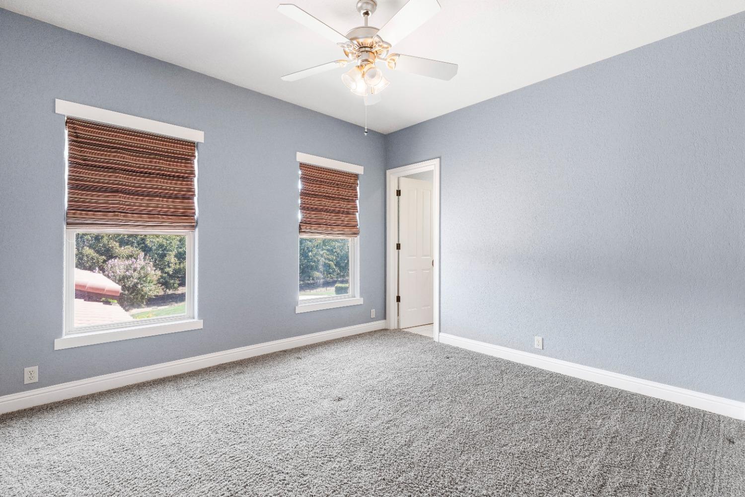 618 Elfers Road Patterson, CA 95363 - Photo 72 of 79 a view of an empty room with window and a ceiling fan