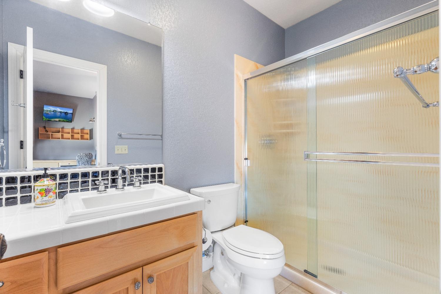 618 Elfers Road Patterson, CA 95363 - Photo 74 of 79 a bathroom with a sink toilet and shower