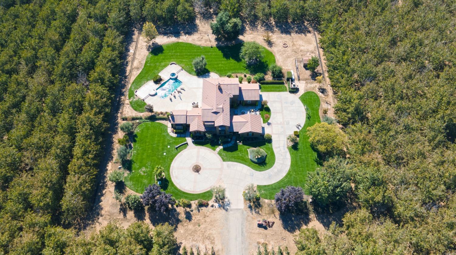 618 Elfers Road Patterson, CA 95363 - Photo 77 of 79 an aerial view of a house with swimming pool and backyard