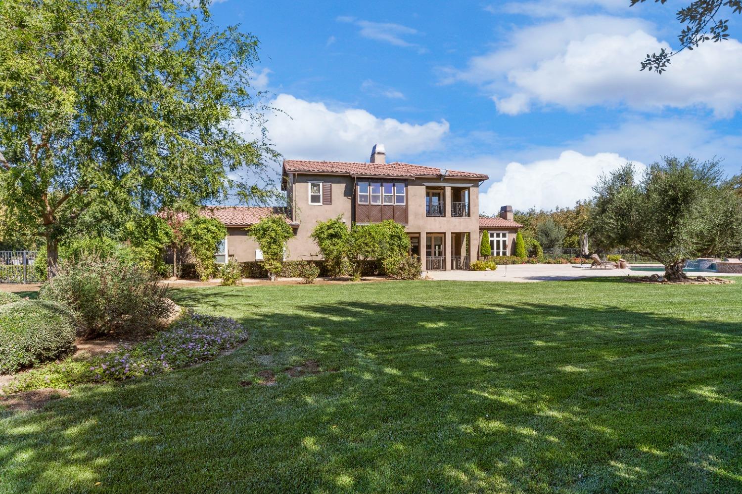 618 Elfers Road Patterson, CA 95363 - Photo 8 of 79 a front view of a house with a yard