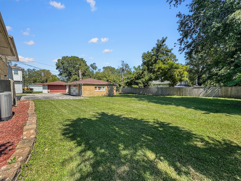 15831 Trumbull Avenue Markham, IL 60428 - Photo 21 of 25 a view of a house with a big yard